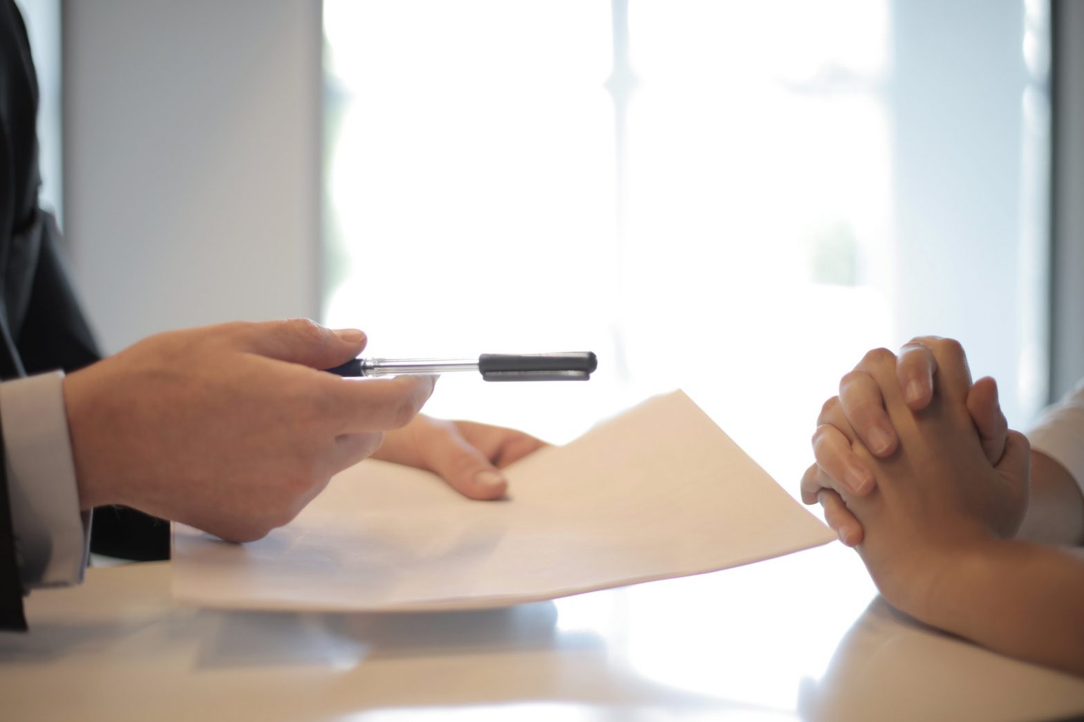 Insurance agent offering policy to customer